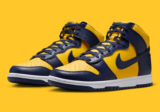 The Nike Dunk High “Michigan” returns with a few tweaks in 2025. The yellow and blue shades are darker, and the leather is different. See it here
