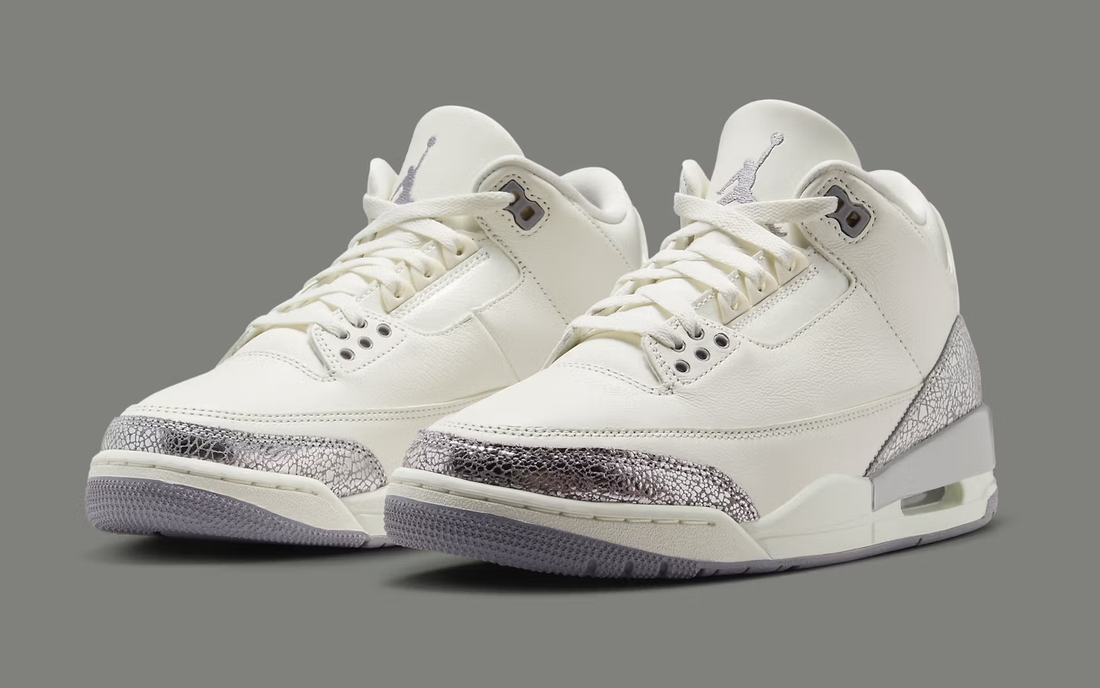 The Air Jordan 3 “Sail/Cement Grey” is one of those women’s shoes that blends everyday wear with a pop of metallic flair.