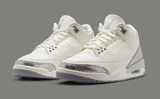 The Air Jordan 3 “Sail/Cement Grey” is one of those women’s shoes that blends everyday wear with a pop of metallic flair.