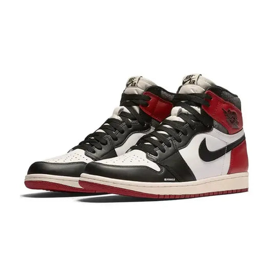 A Pair of Air Jordan 1 High OG Black Toe 