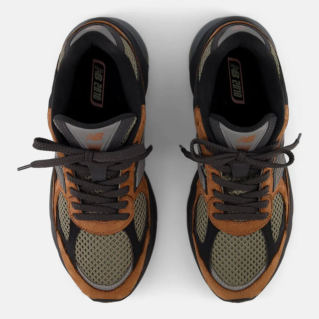 If you’re already obsessed with the New Balance 9060, the 2010 “Vintage Khaki” and “Black Brown” is your next grail. It’s got that chunky, retro vibe we’re all craving, with heavy inspo from the 990 series archives.