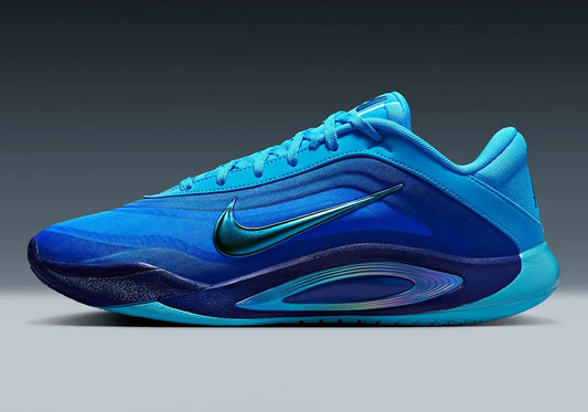 The A’One “Indigo Girl” keeps the same silhouette as the debut “Pink Aura”, but trades pinks for layered blues. The upper fades from navy to icy blue, centering a metallic Swoosh. The outsole, tongue, and heel follow the blue vibe.